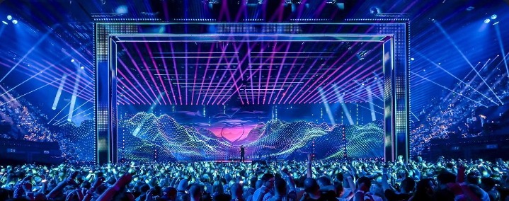 Live concert stage with colorful lights and audience